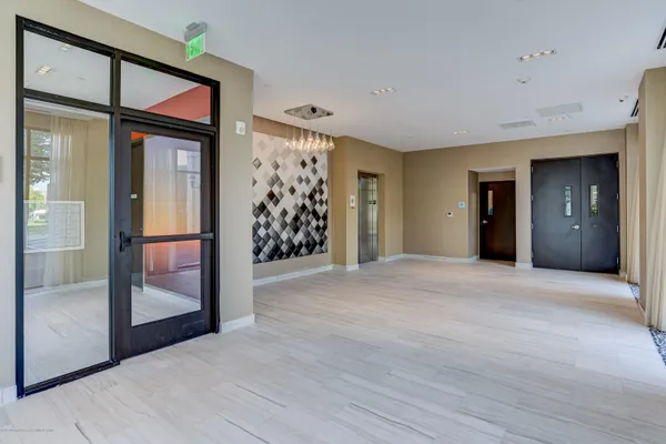 wooden floor and ceiling fan in a room