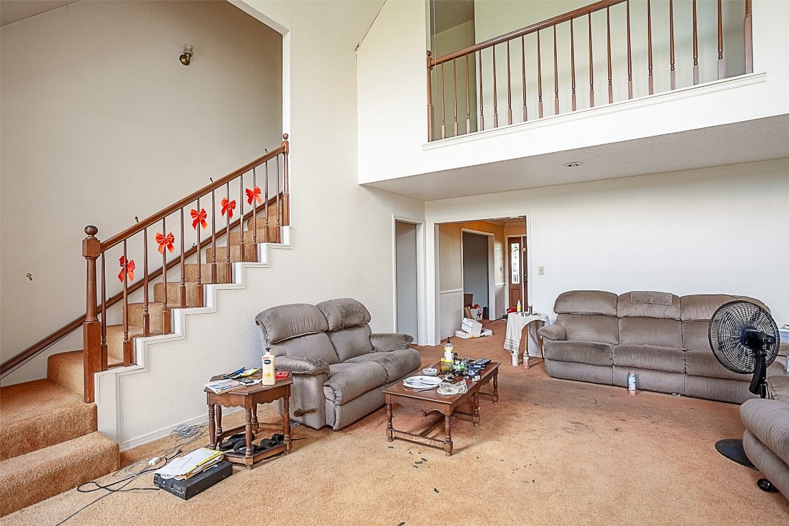 2330 Lavender Street Port Arthur, TX 77640 - Photo 8 of 34 a living room with furniture stairs and a couch