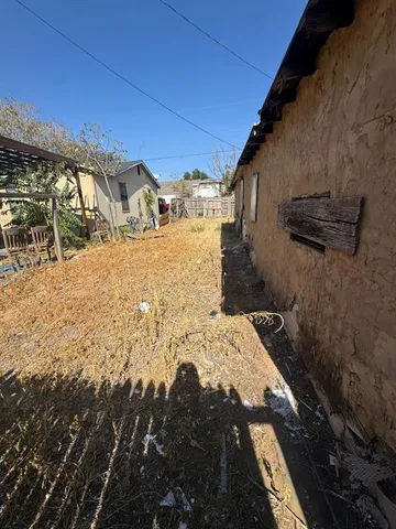 a view of a backyard of the house
