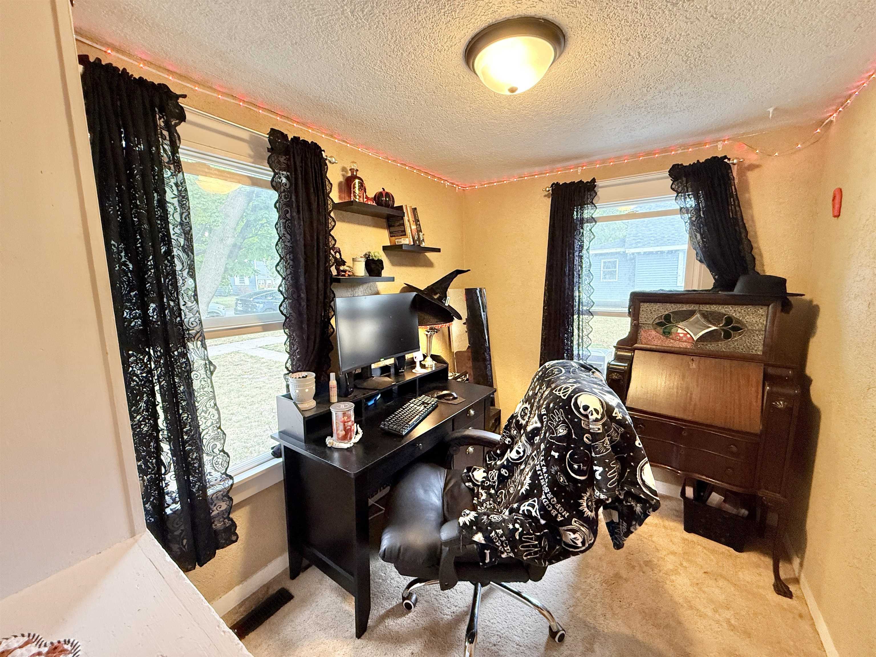 503 South 3rd Street Oregon, IL 61061 - Photo 18 of 22 a bedroom with furniture and a flat screen tv