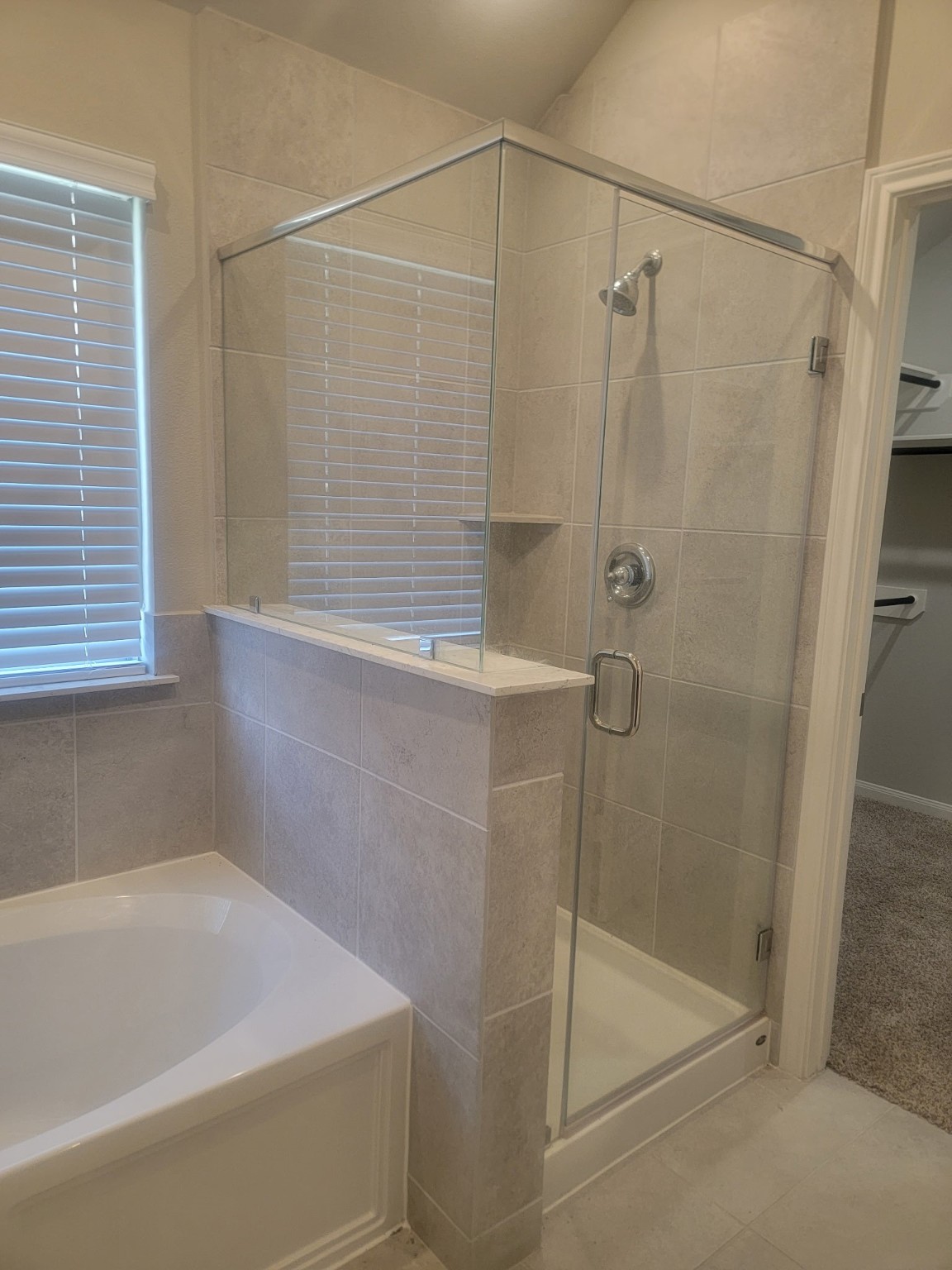 1406 Munson Valley Road Richmond, TX 77406 - Photo 15 of 27 a bathroom with a shower and a bathtub