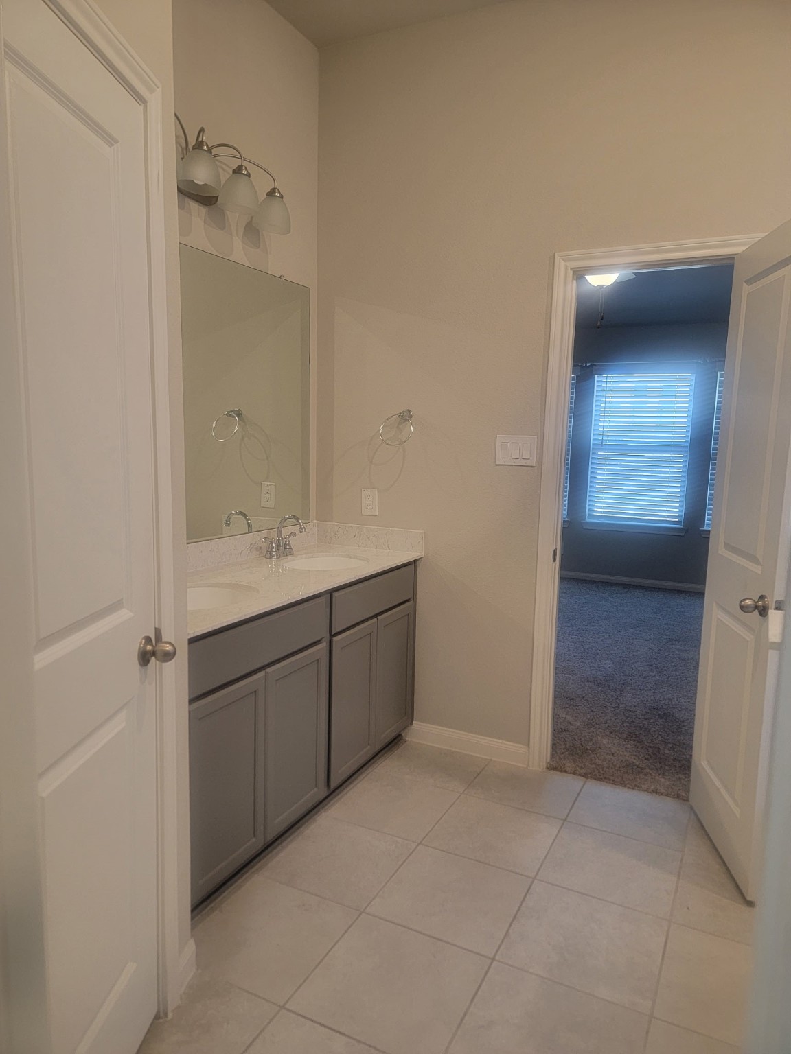 1406 Munson Valley Road Richmond, TX 77406 - Photo 19 of 27 a bathroom with a sink vanity and mirror