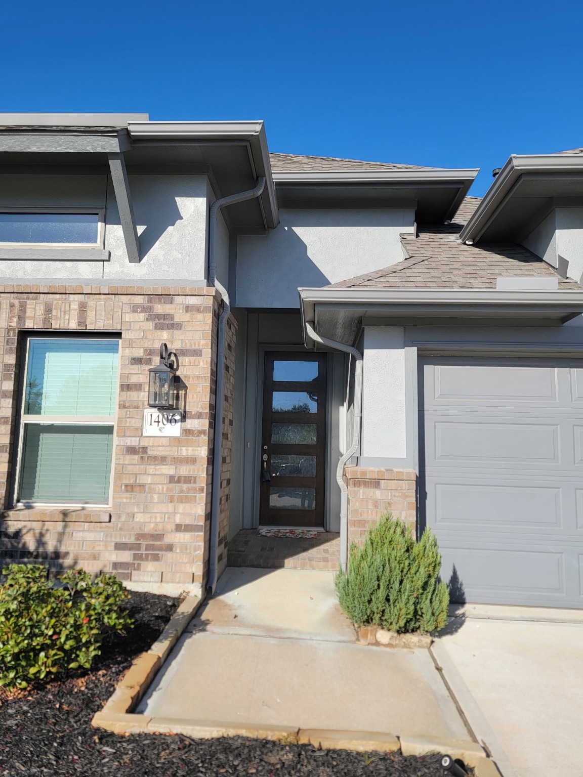 1406 Munson Valley Road Richmond, TX 77406 - Photo 2 of 27 a front view of a house with garden
