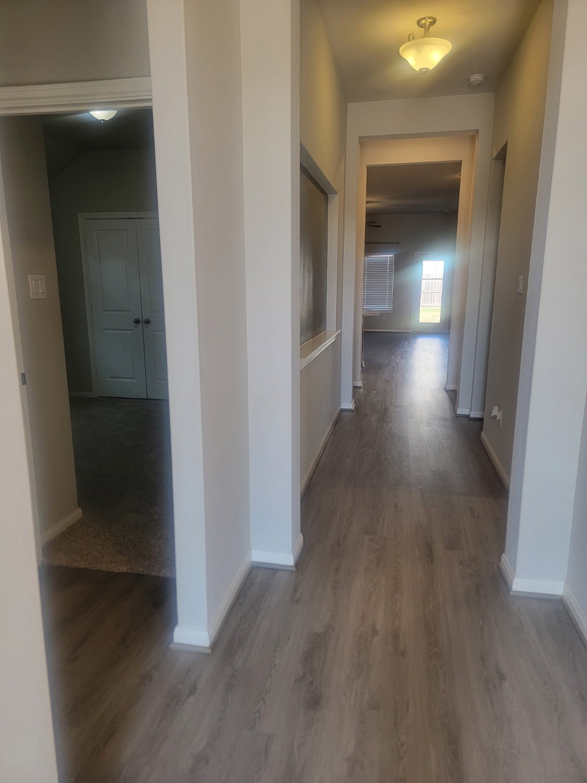 1406 Munson Valley Road Richmond, TX 77406 - Photo 3 of 27 a view of a hallway with wooden floor