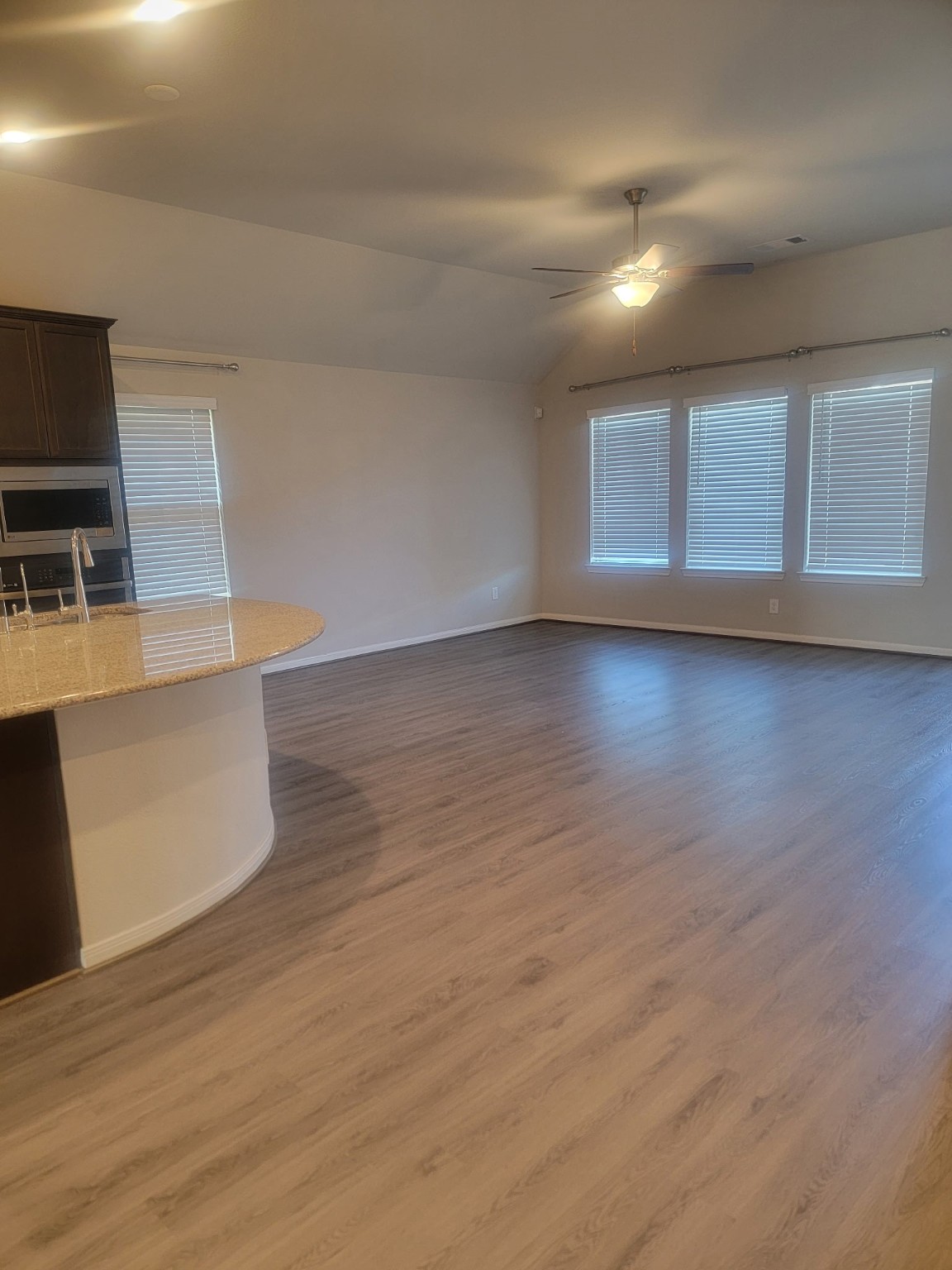 1406 Munson Valley Road Richmond, TX 77406 - Photo 6 of 27 a view of a kitchen with microwave and cabinets