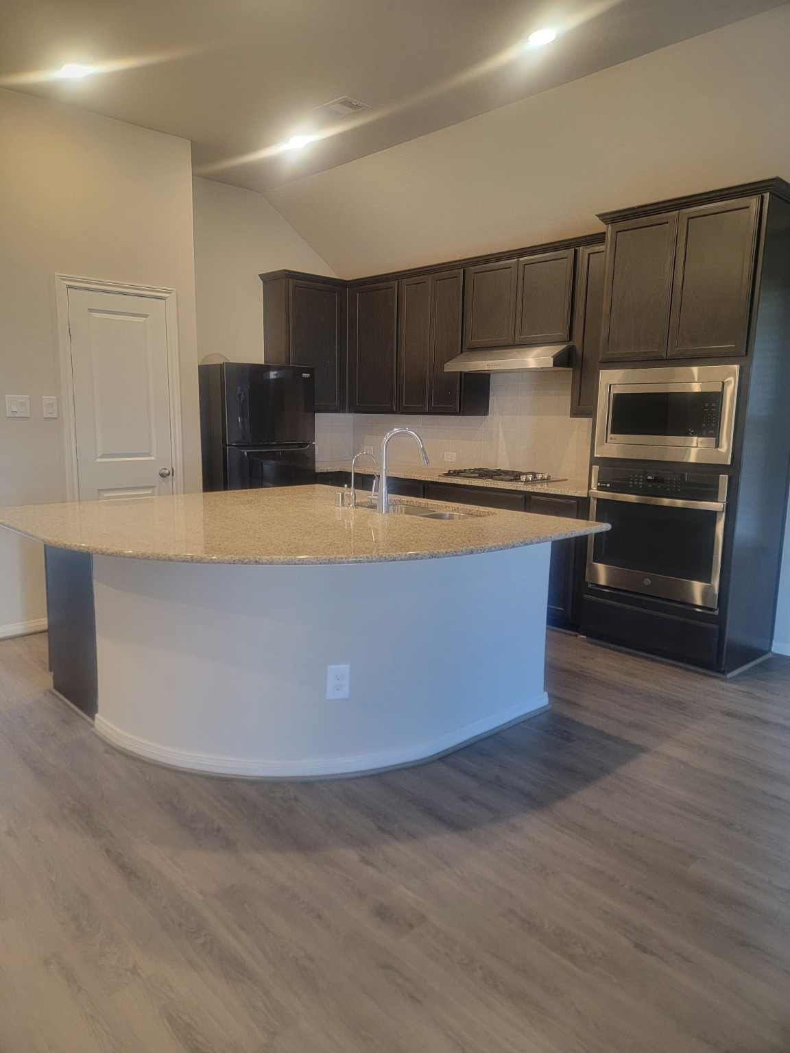 1406 Munson Valley Road Richmond, TX 77406 - Photo 9 of 27 a kitchen with stainless steel appliances a large counter top
