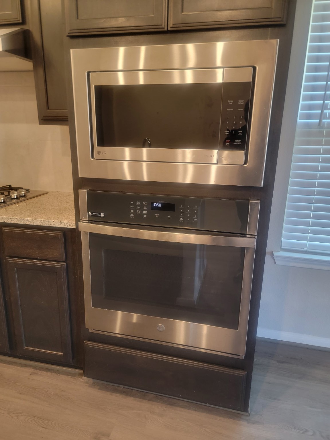 1406 Munson Valley Road Richmond, TX 77406 - Photo 10 of 27 a stove top oven sitting inside of a kitchen