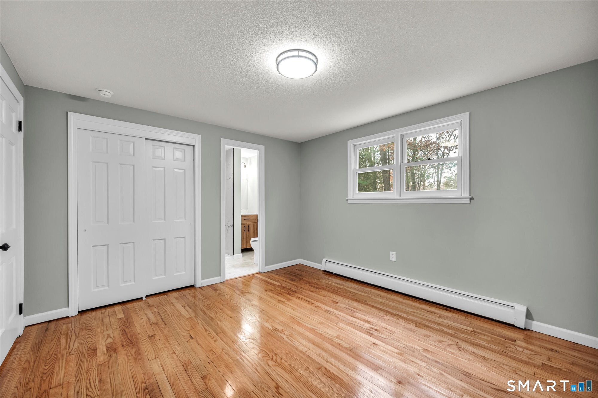 84 Raffia Road Enfield, CT 06082 - Photo 20 of 34 a view of empty room with wooden floor