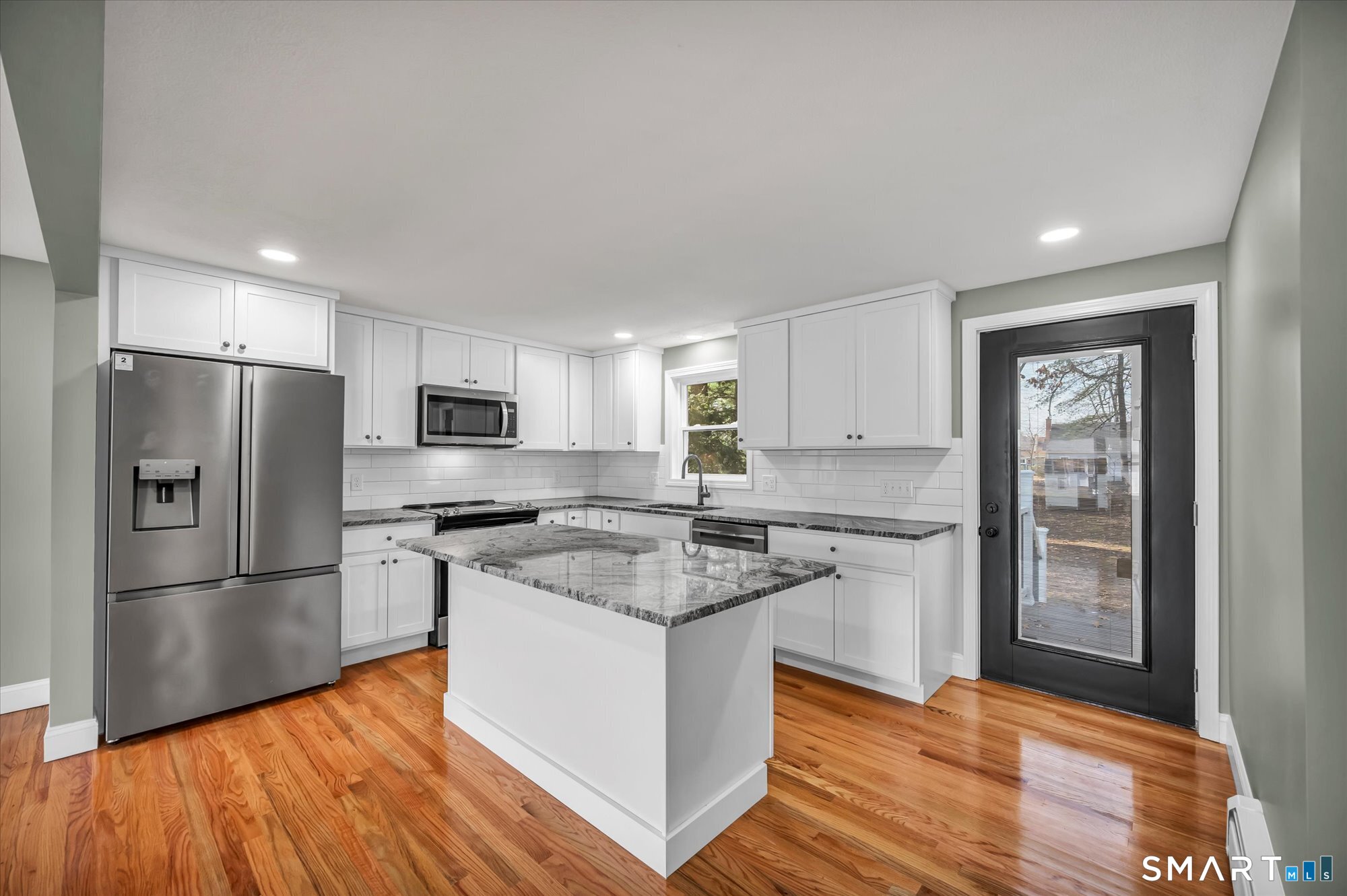 84 Raffia Road Enfield, CT 06082 - Photo 2 of 34 a kitchen with stainless steel appliances granite countertop a sink stove and refrigerator