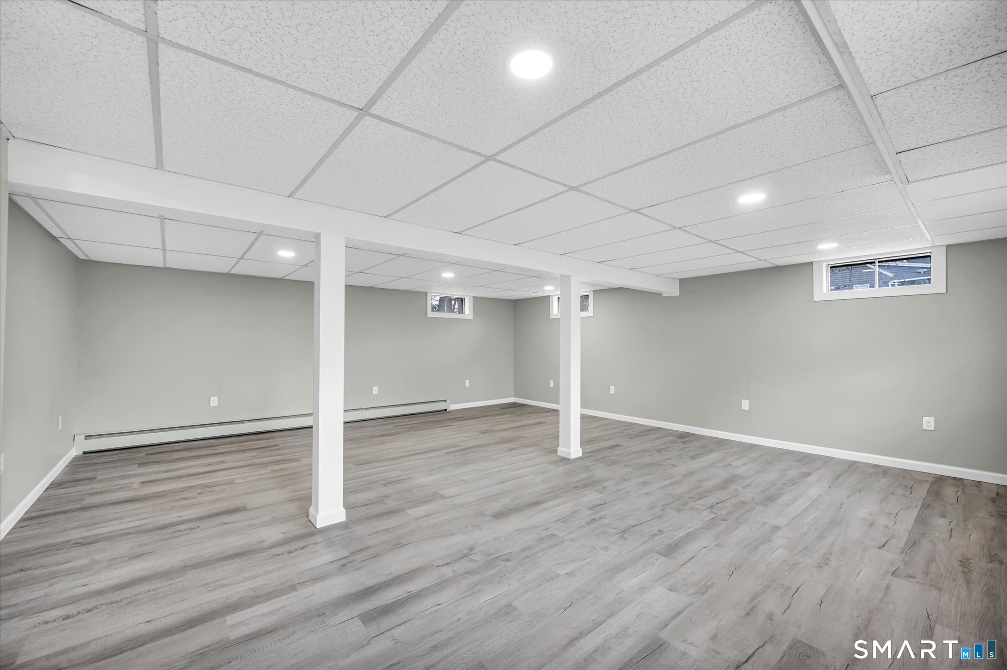 84 Raffia Road Enfield, CT 06082 - Photo 25 of 34 an empty room with wooden floor