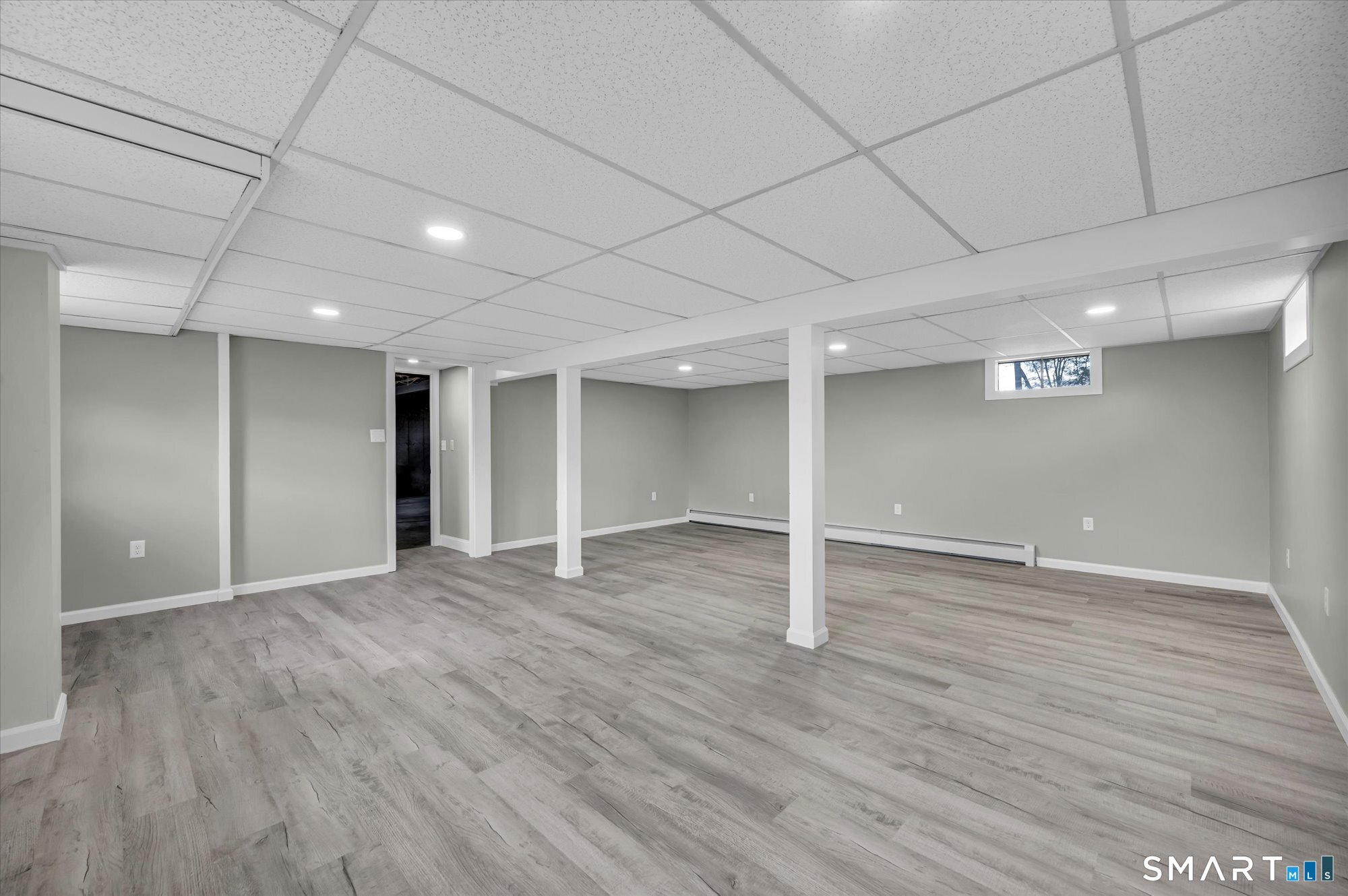 84 Raffia Road Enfield, CT 06082 - Photo 26 of 34 an empty room with wooden floor and window