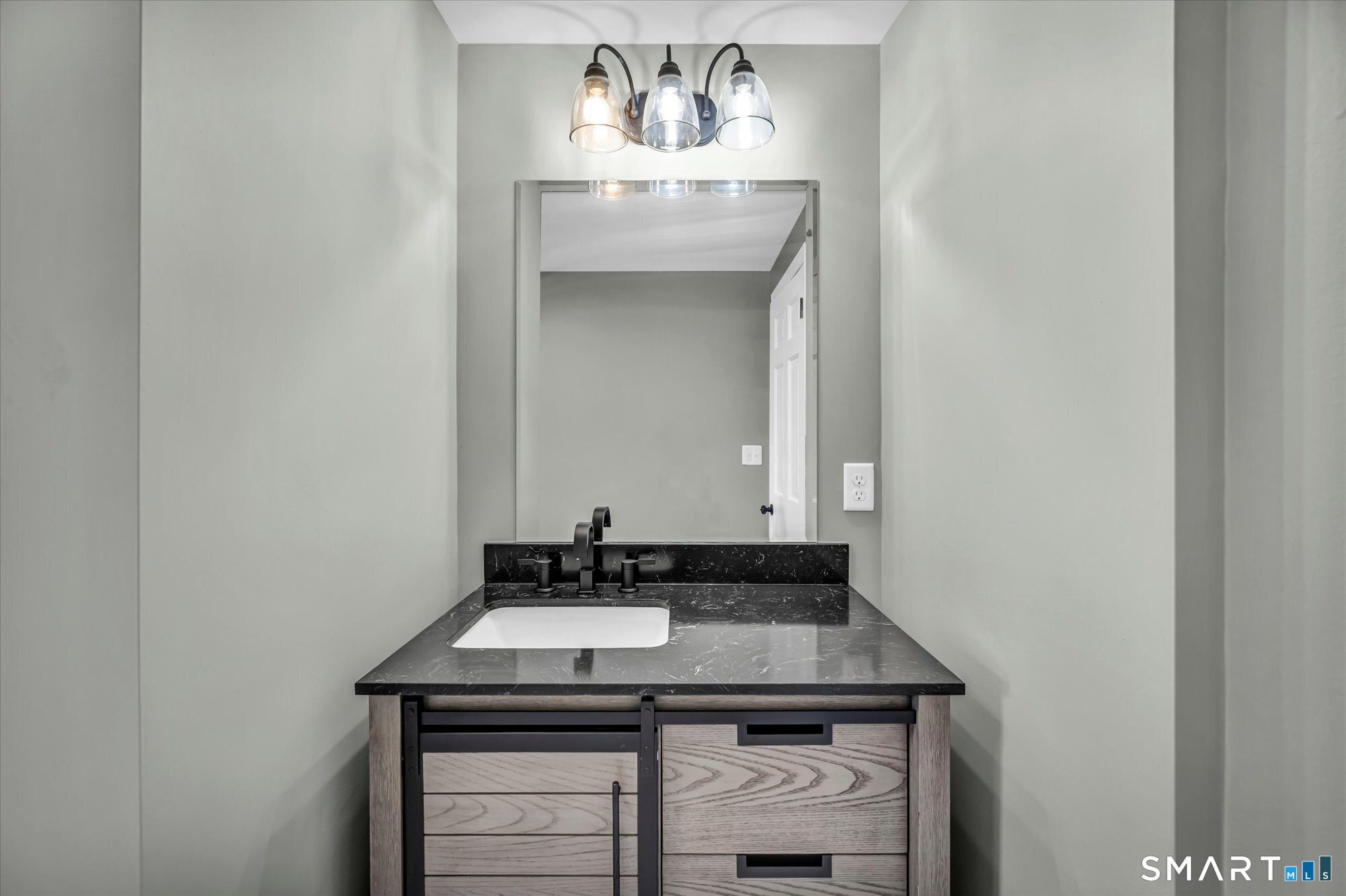 84 Raffia Road Enfield, CT 06082 - Photo 10 of 34 a bathroom with a sink and a mirror