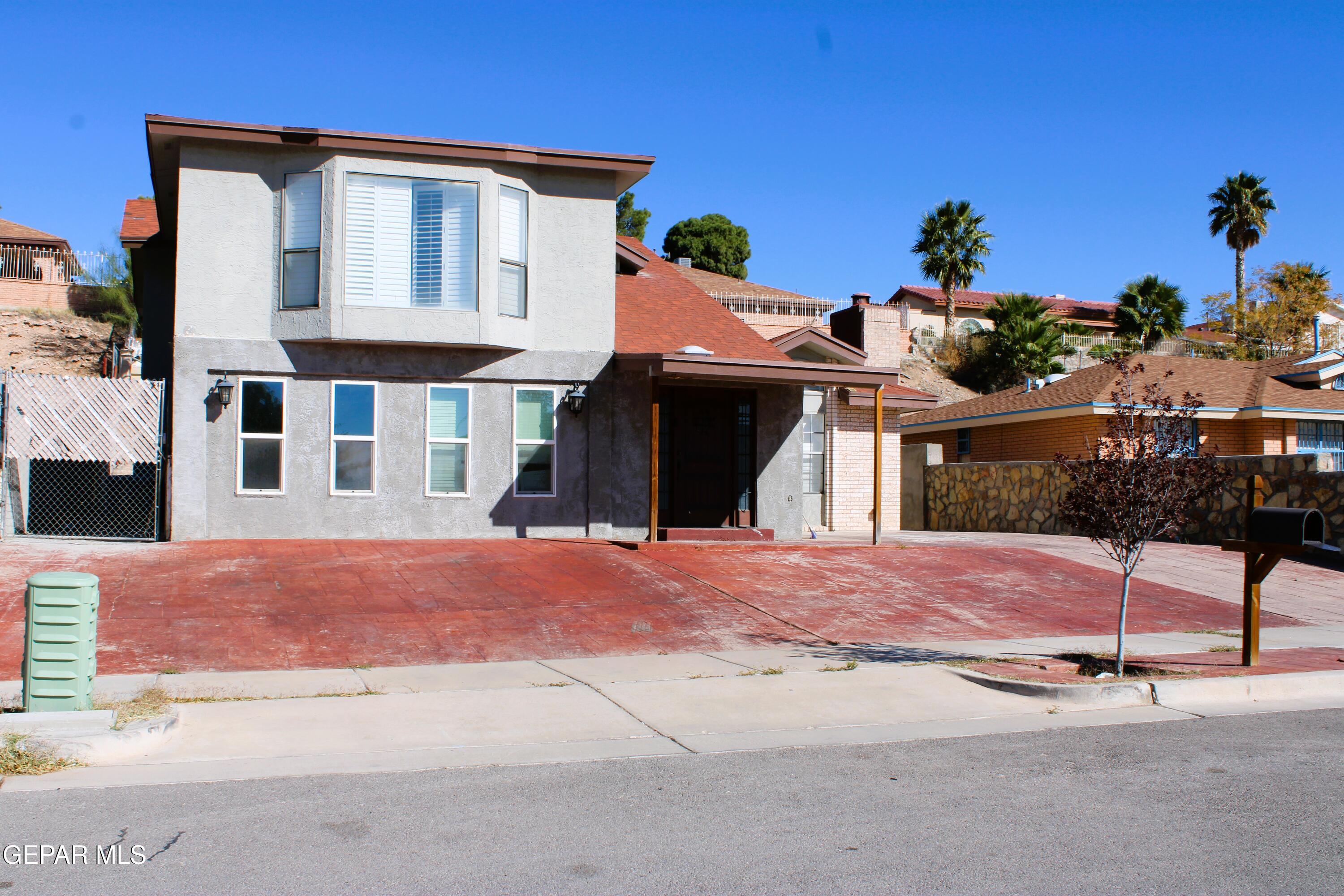 1639 Brian Ray Circle El Paso, TX 79936 - Photo 11 of 52 a front view of a house with a yard