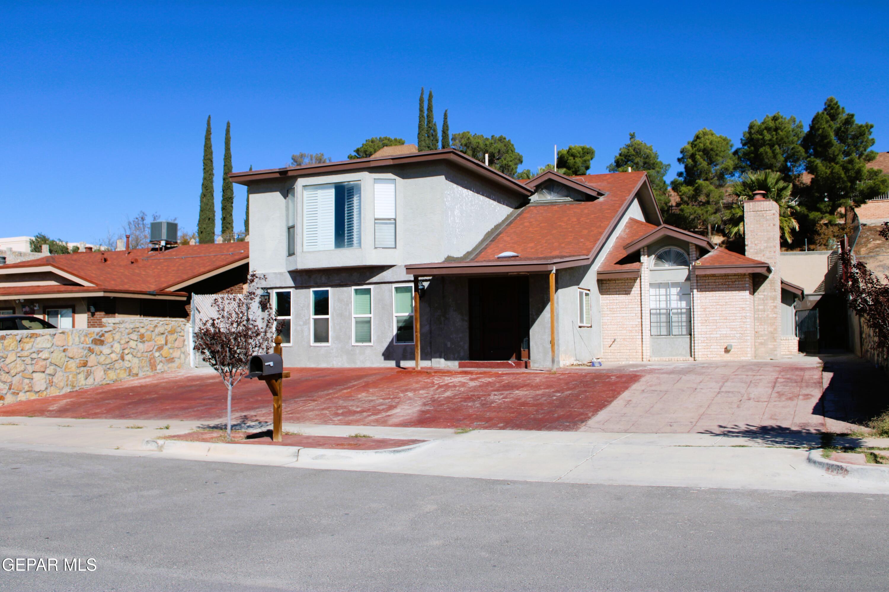 1639 Brian Ray Circle El Paso, TX 79936 - Photo 12 of 52 a front view of a house with a yard and garage