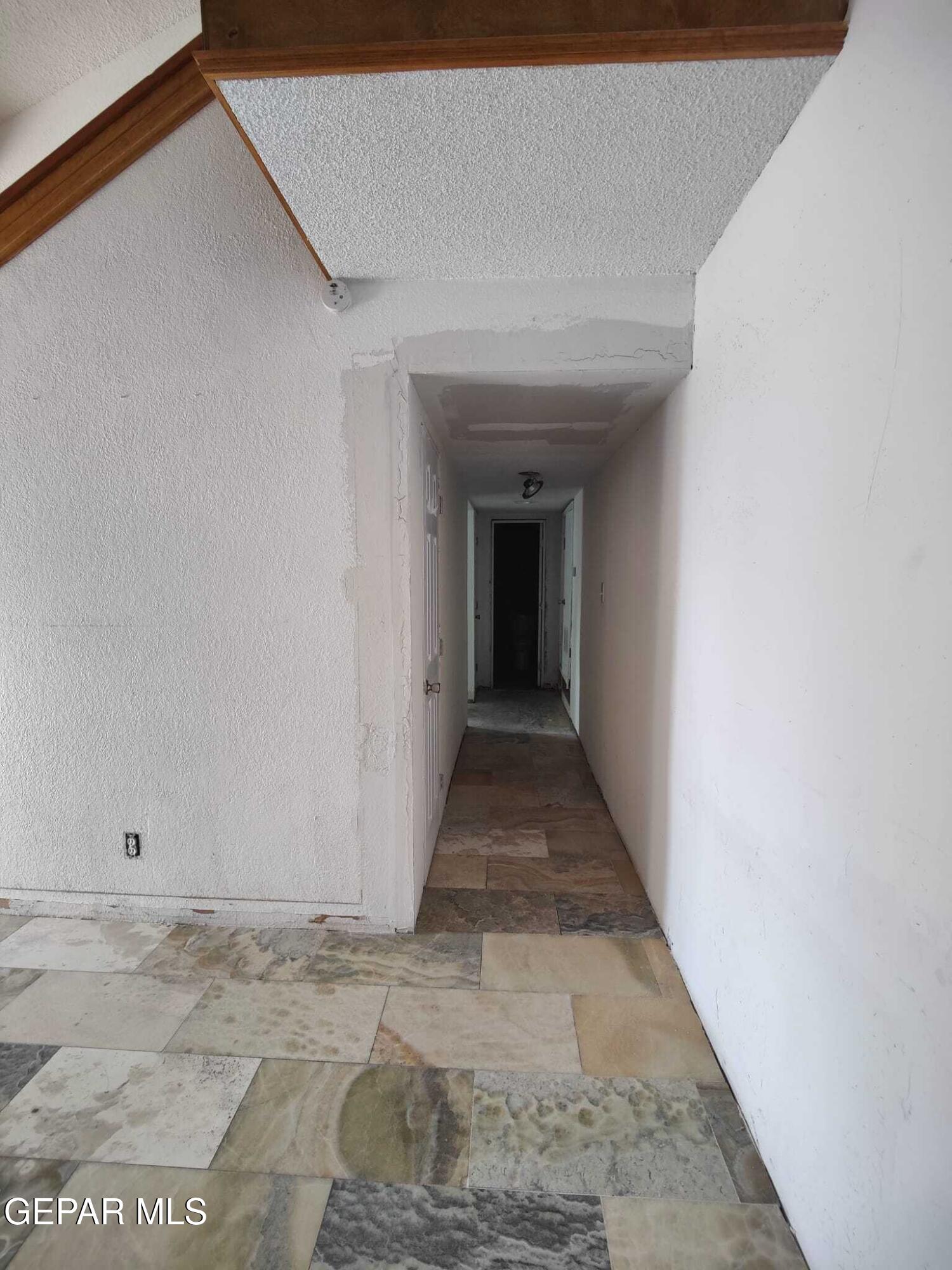 1639 Brian Ray Circle El Paso, TX 79936 - Photo 23 of 52 a view of a hallway with white walls