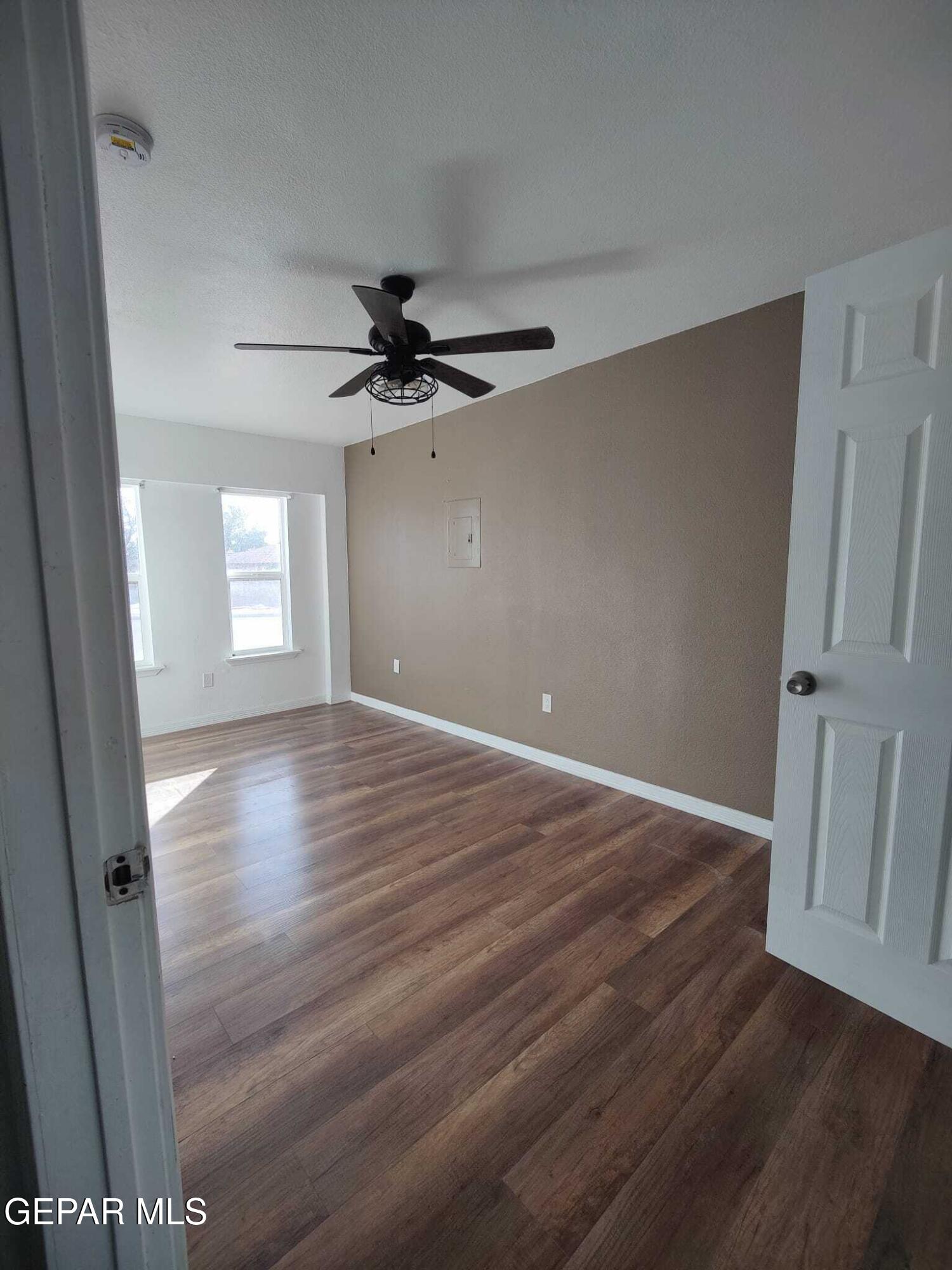 1639 Brian Ray Circle El Paso, TX 79936 - Photo 27 of 52 wooden floor in an empty room with a window