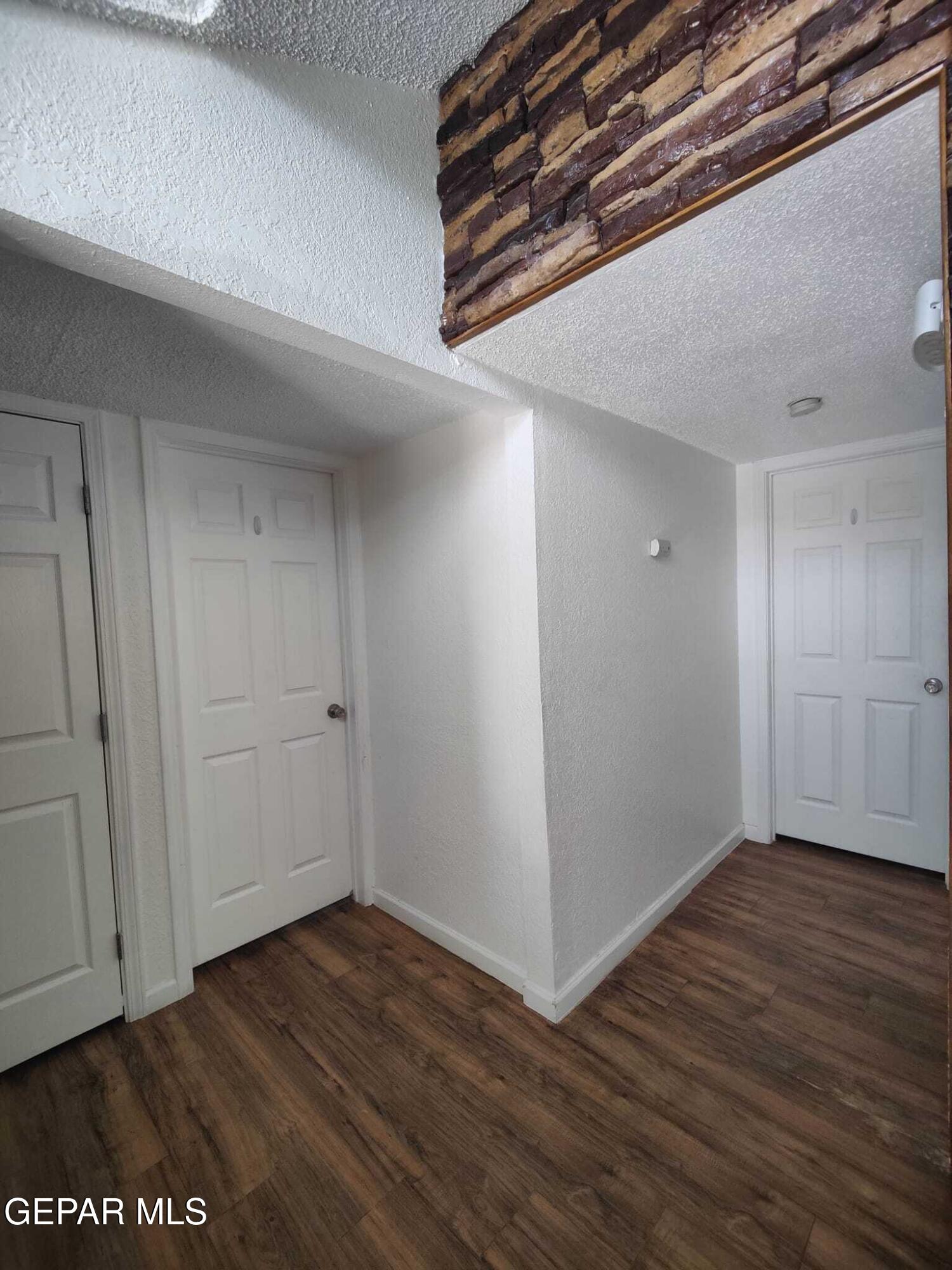 1639 Brian Ray Circle El Paso, TX 79936 - Photo 32 of 52 a view of an empty room with wooden floor