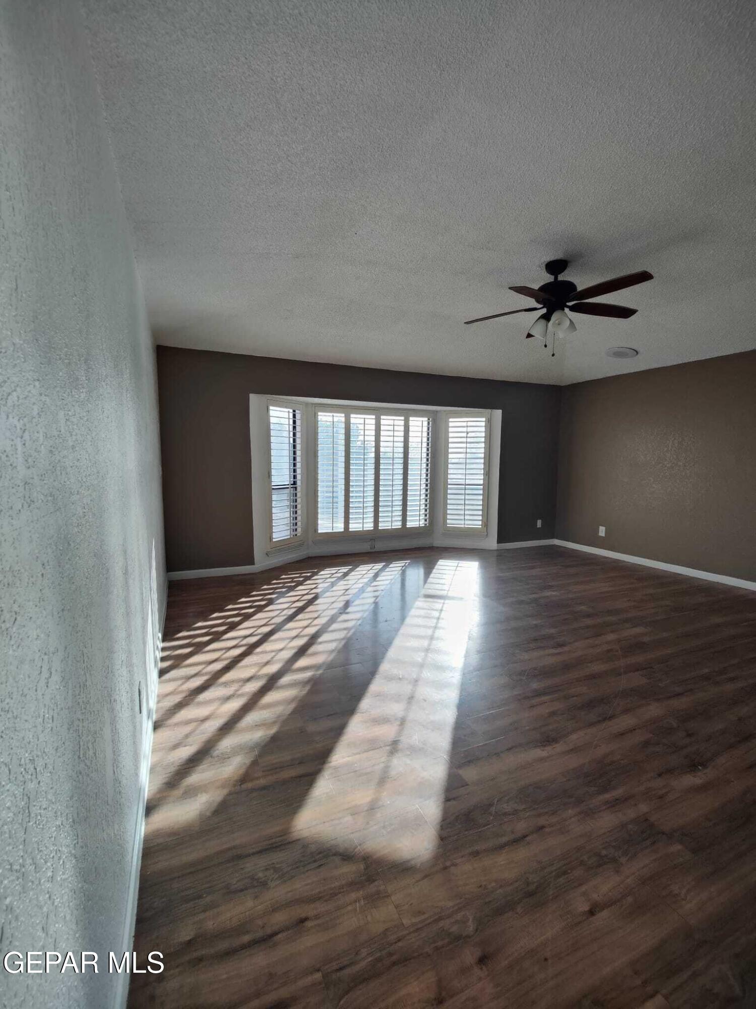 1639 Brian Ray Circle El Paso, TX 79936 - Photo 42 of 52 wooden floor in an empty room with a window