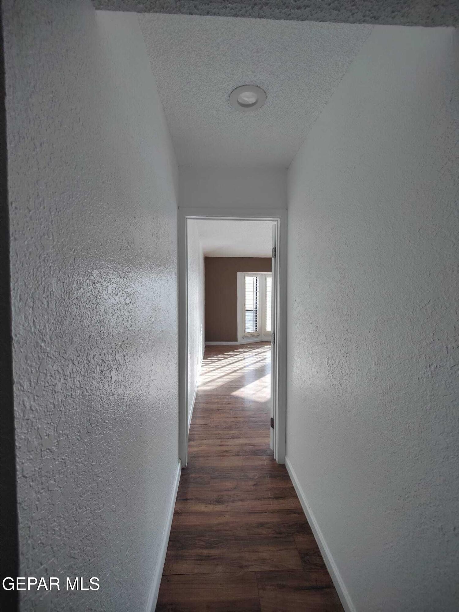 1639 Brian Ray Circle El Paso, TX 79936 - Photo 45 of 52 a view of a hallway with wooden floor