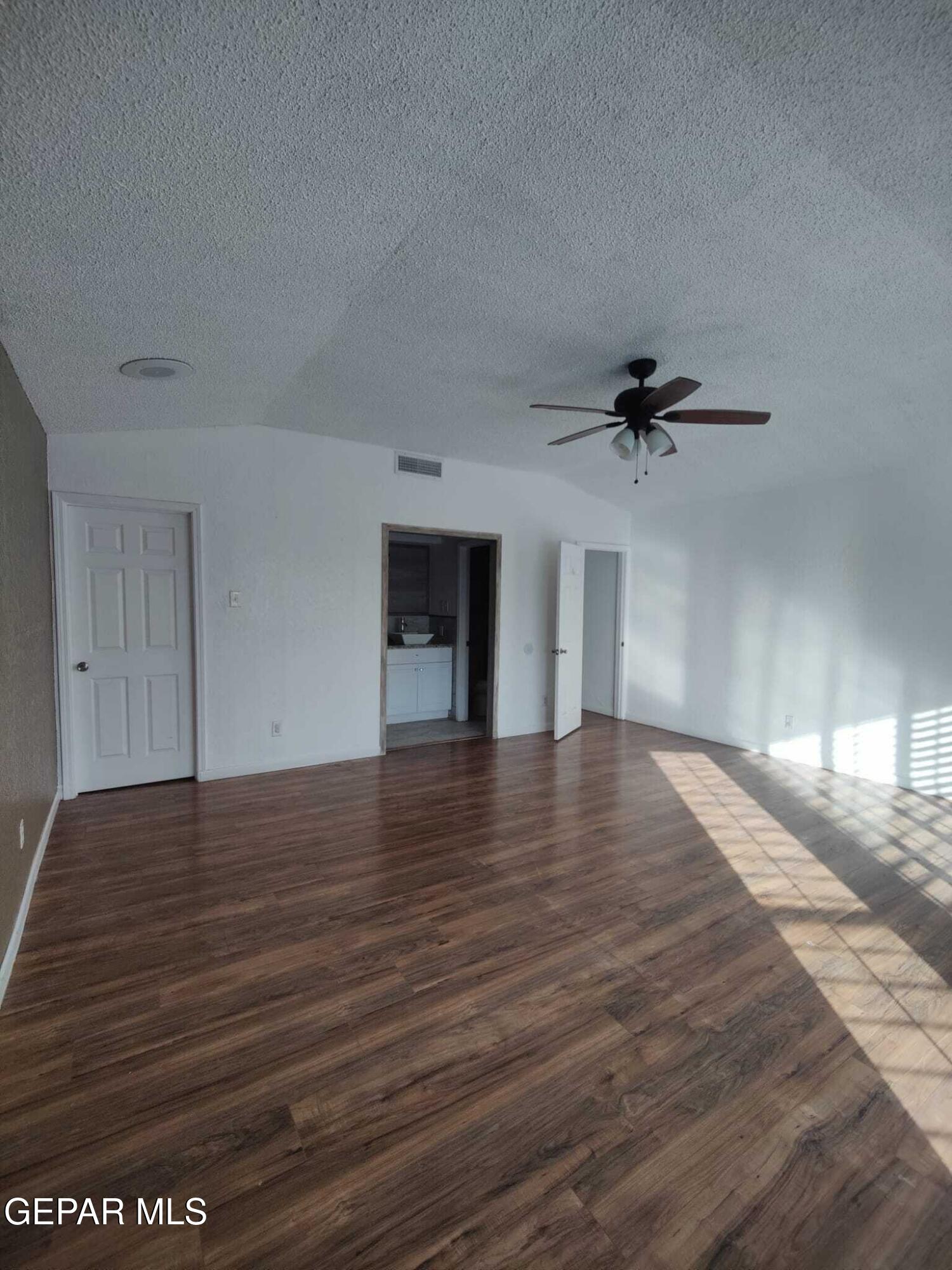 1639 Brian Ray Circle El Paso, TX 79936 - Photo 47 of 52 a view of empty room with wooden floor and fan