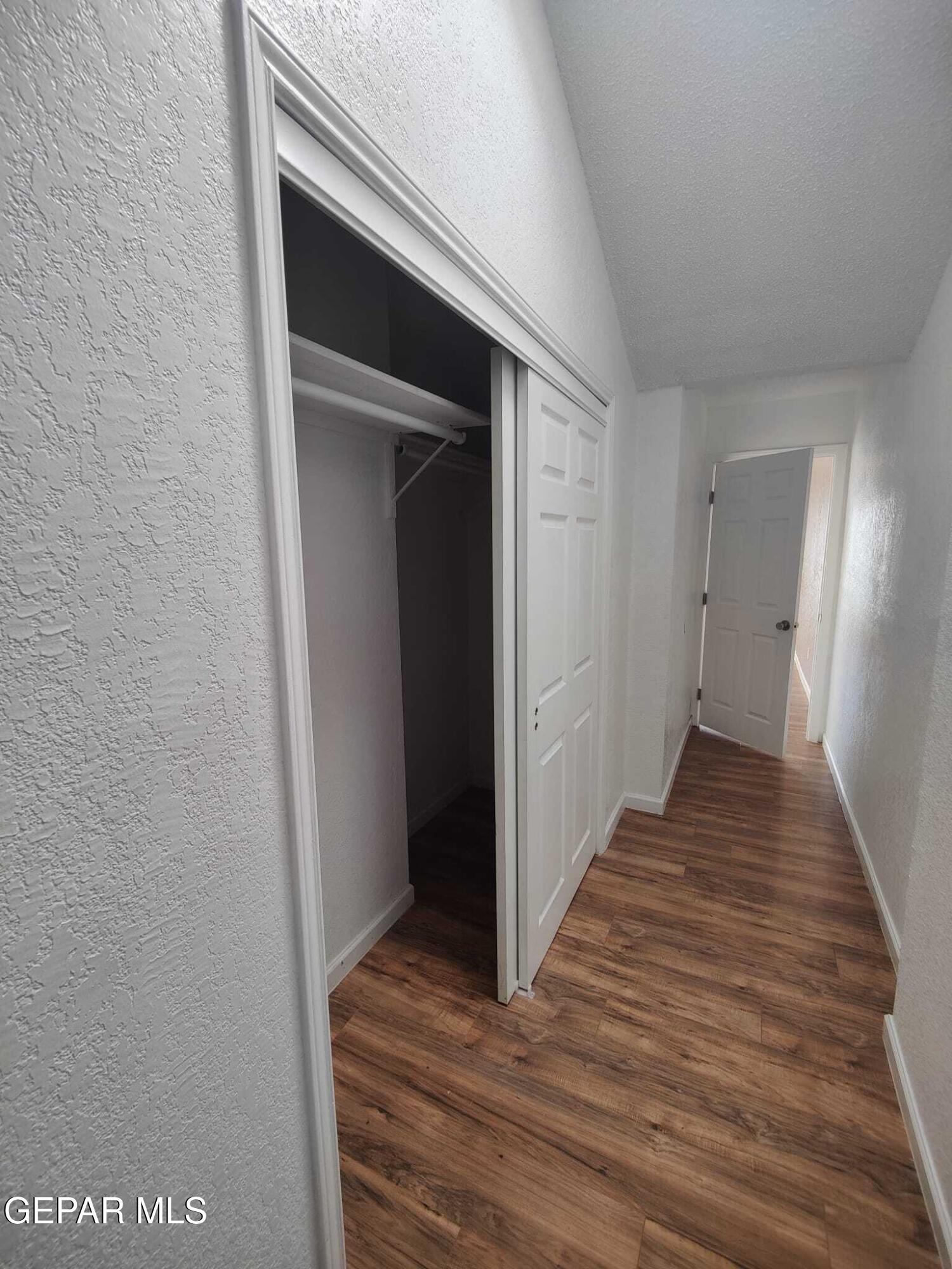 1639 Brian Ray Circle El Paso, TX 79936 - Photo 49 of 52 a view of a hallway with wooden floor