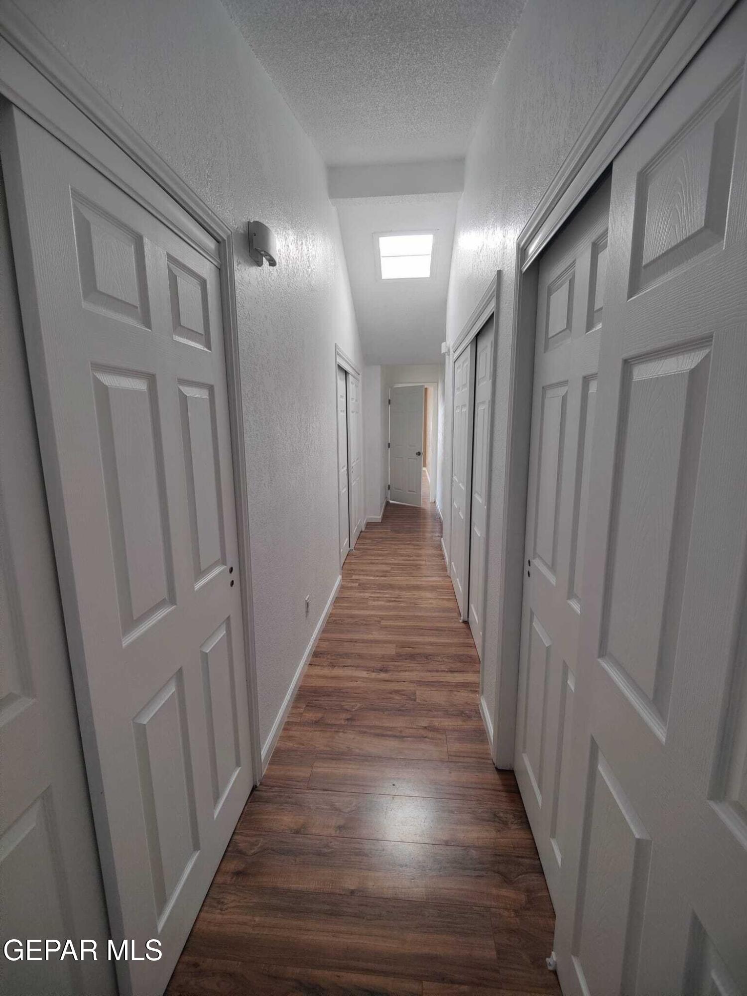 1639 Brian Ray Circle El Paso, TX 79936 - Photo 50 of 52 a view of a hallway with wooden floor