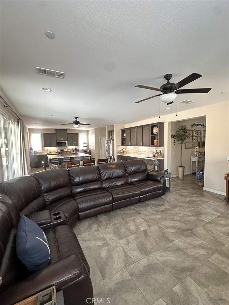 39552 Strada Scala Lake Elsinore, CA 92532 - Photo 12 of 40 a living room with furniture
