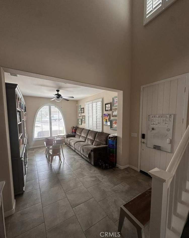 39552 Strada Scala Lake Elsinore, CA 92532 - Photo 13 of 40 a living room with furniture and a large window
