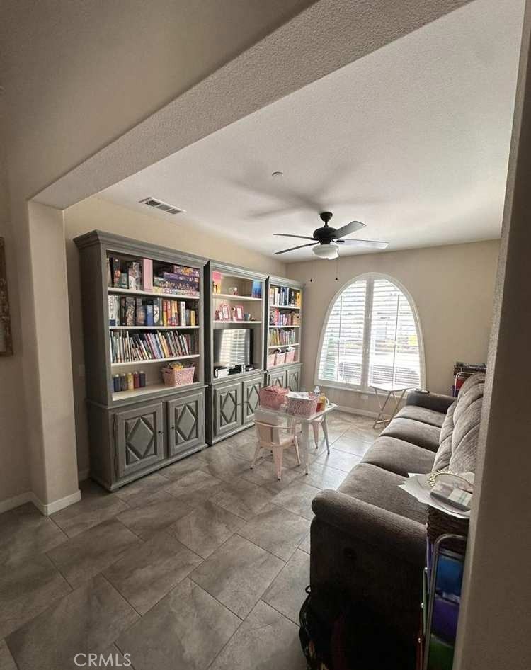 39552 Strada Scala Lake Elsinore, CA 92532 - Photo 14 of 40 a living room with furniture and a large window