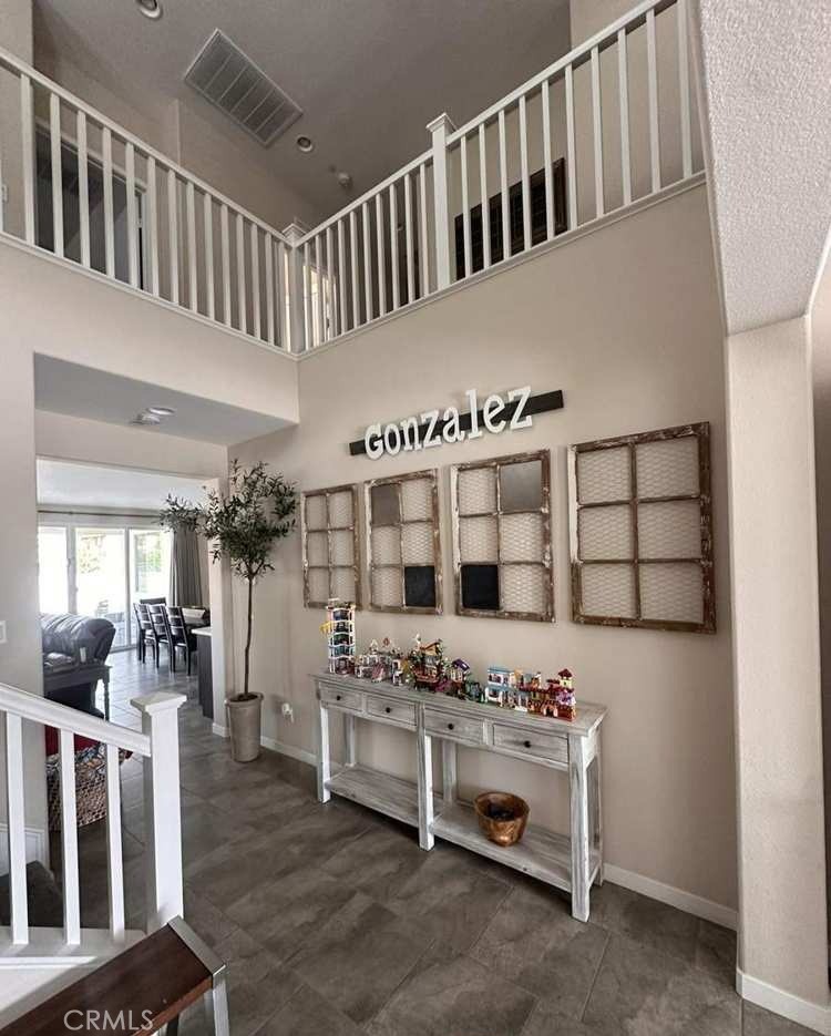39552 Strada Scala Lake Elsinore, CA 92532 - Photo 15 of 40 a view of living room kitchen and entryway