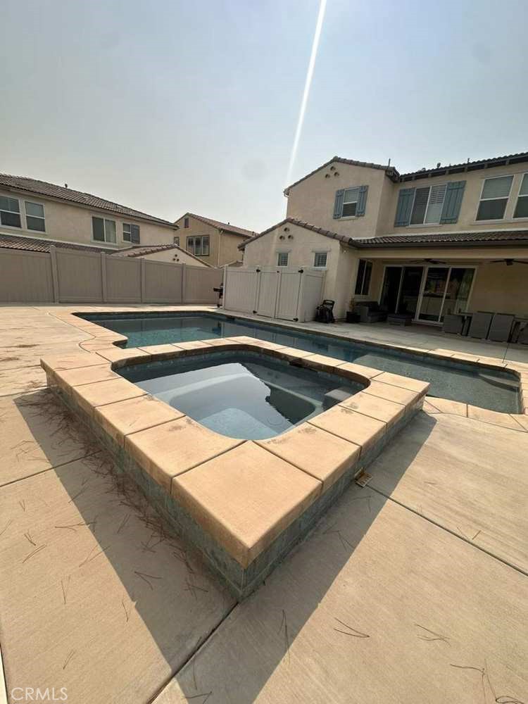 39552 Strada Scala Lake Elsinore, CA 92532 - Photo 19 of 40 a view of houses with a swimming pool
