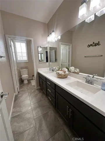 a bathroom with a sink a vanity and a mirror