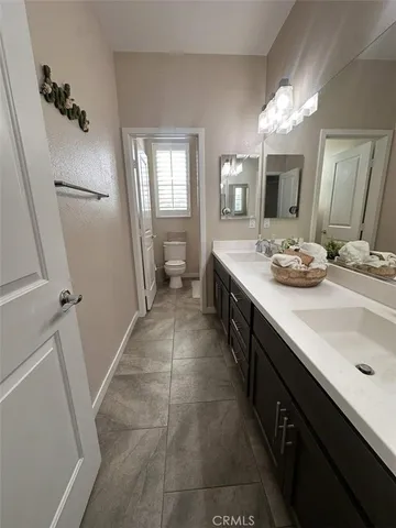 a bathroom with a sink a vanity and a mirror