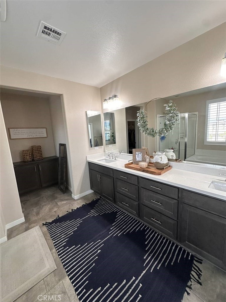 39552 Strada Scala Lake Elsinore, CA 92532 - Photo 36 of 40 a bathroom with a sink and a mirror