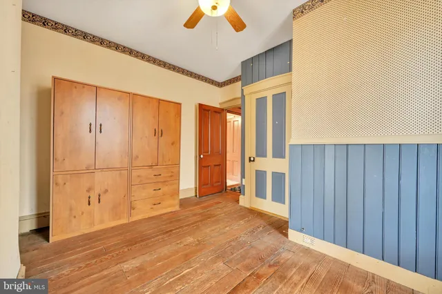 a room with furniture a rug and a window