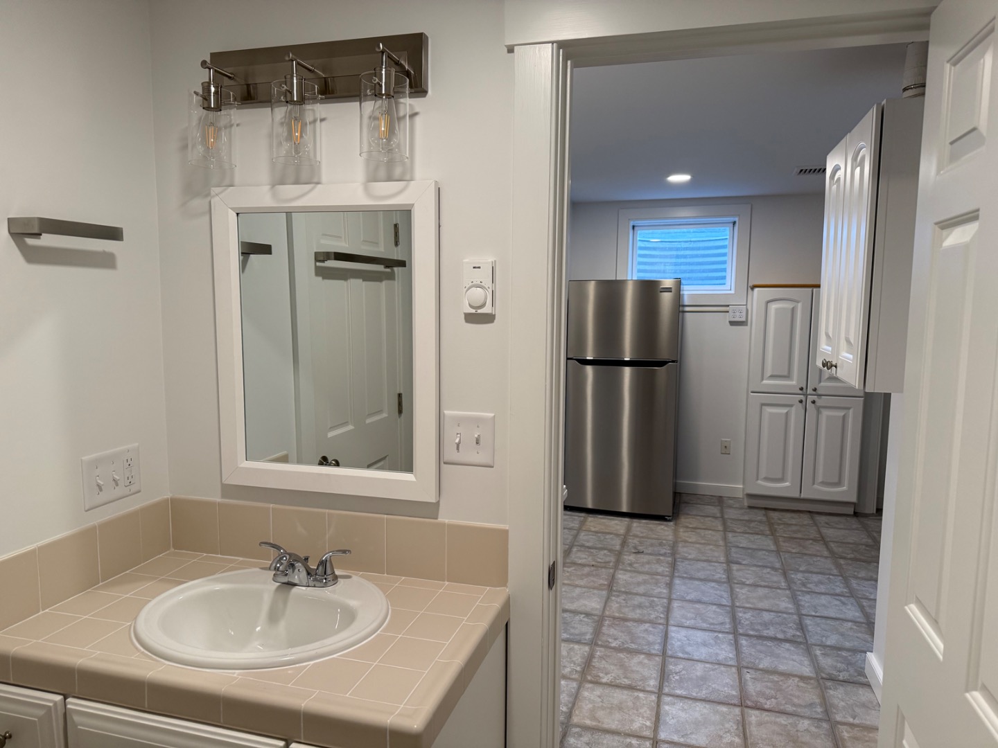 106 Old South Road, Unit A B Nantucket, MA 02554 - Photo 24 of 24 a bathroom with a sink a mirror and a shower