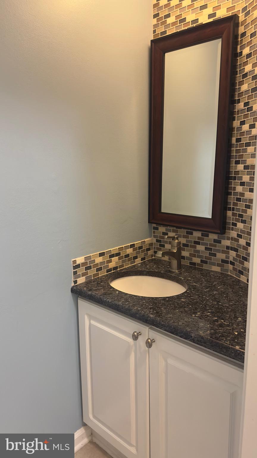 342 Brigade Court, Unit 342 Chesterbrook, PA 19087 - Photo 8 of 16 a bathroom with a sink and a mirror