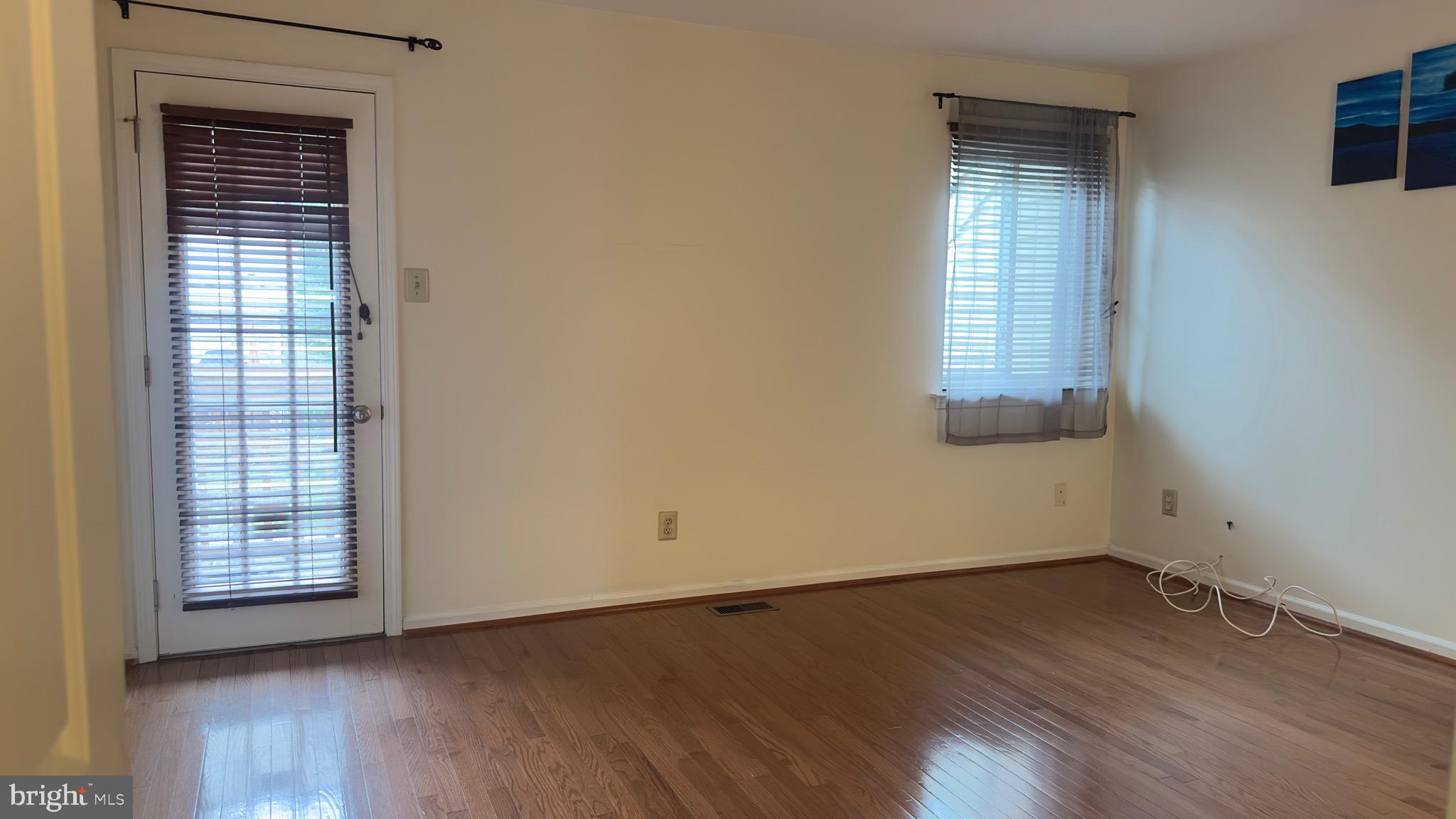 342 Brigade Court, Unit 342 Chesterbrook, PA 19087 - Photo 9 of 16 an empty room with wooden floor and windows