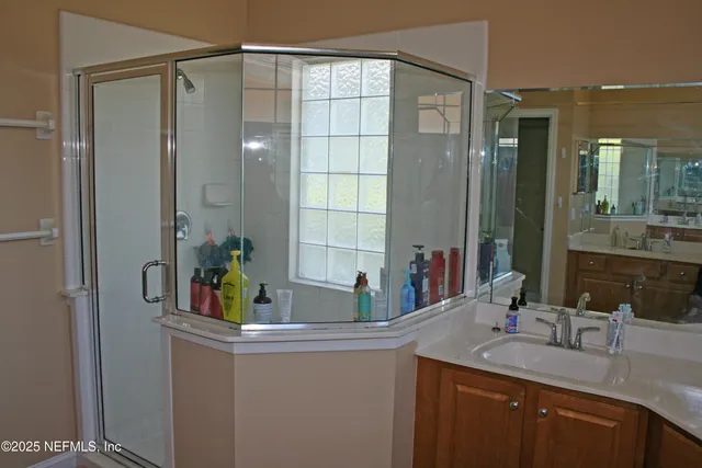 a bathroom with a sink and a mirror