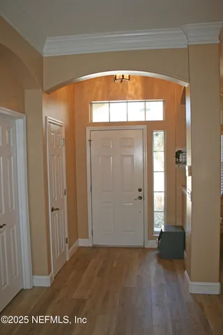 an empty room with windows and closet