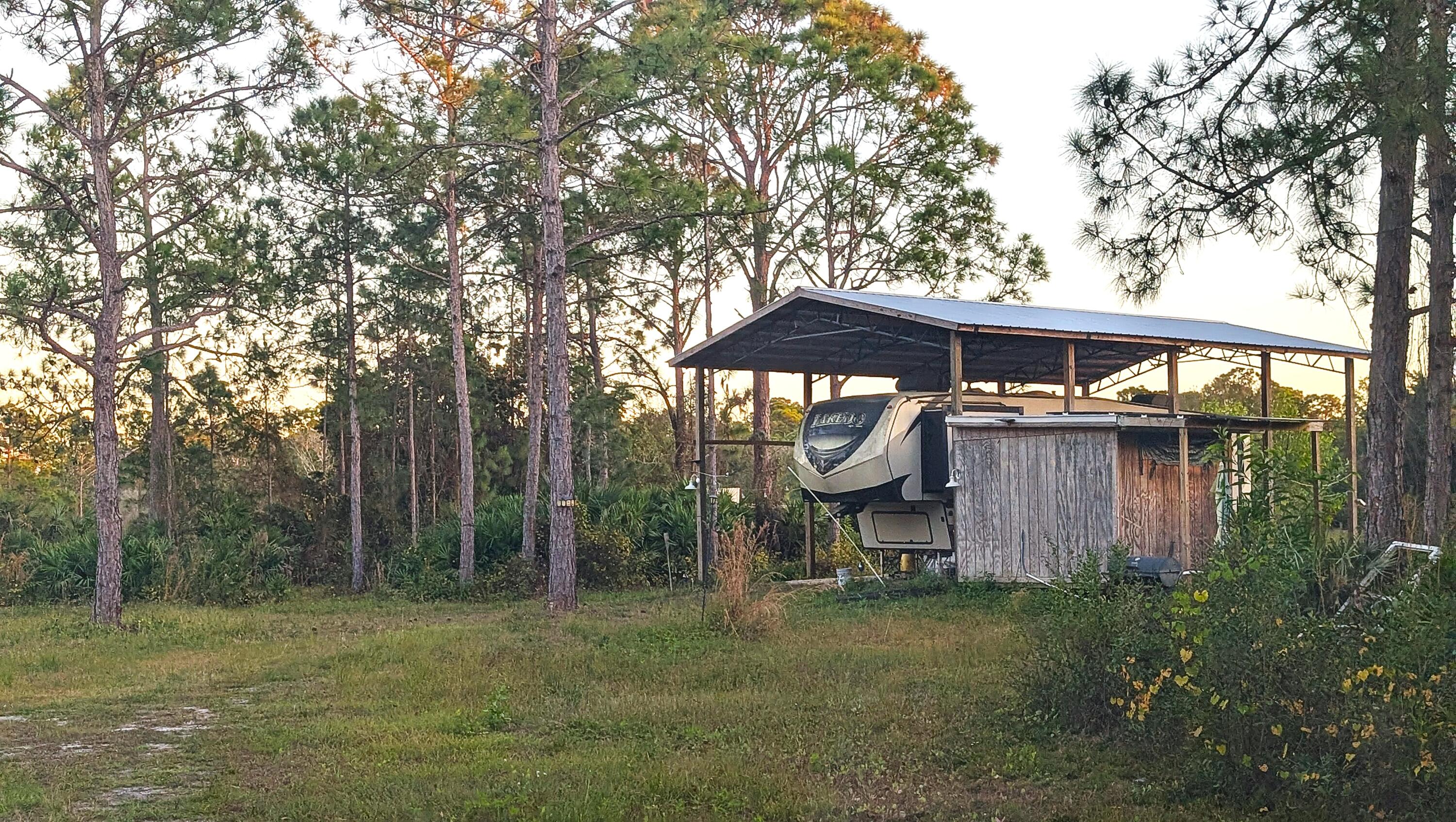 12885 86th Street Fellsmere, FL 32948 - Photo 3 of 3 a view of a wooden house with a yard