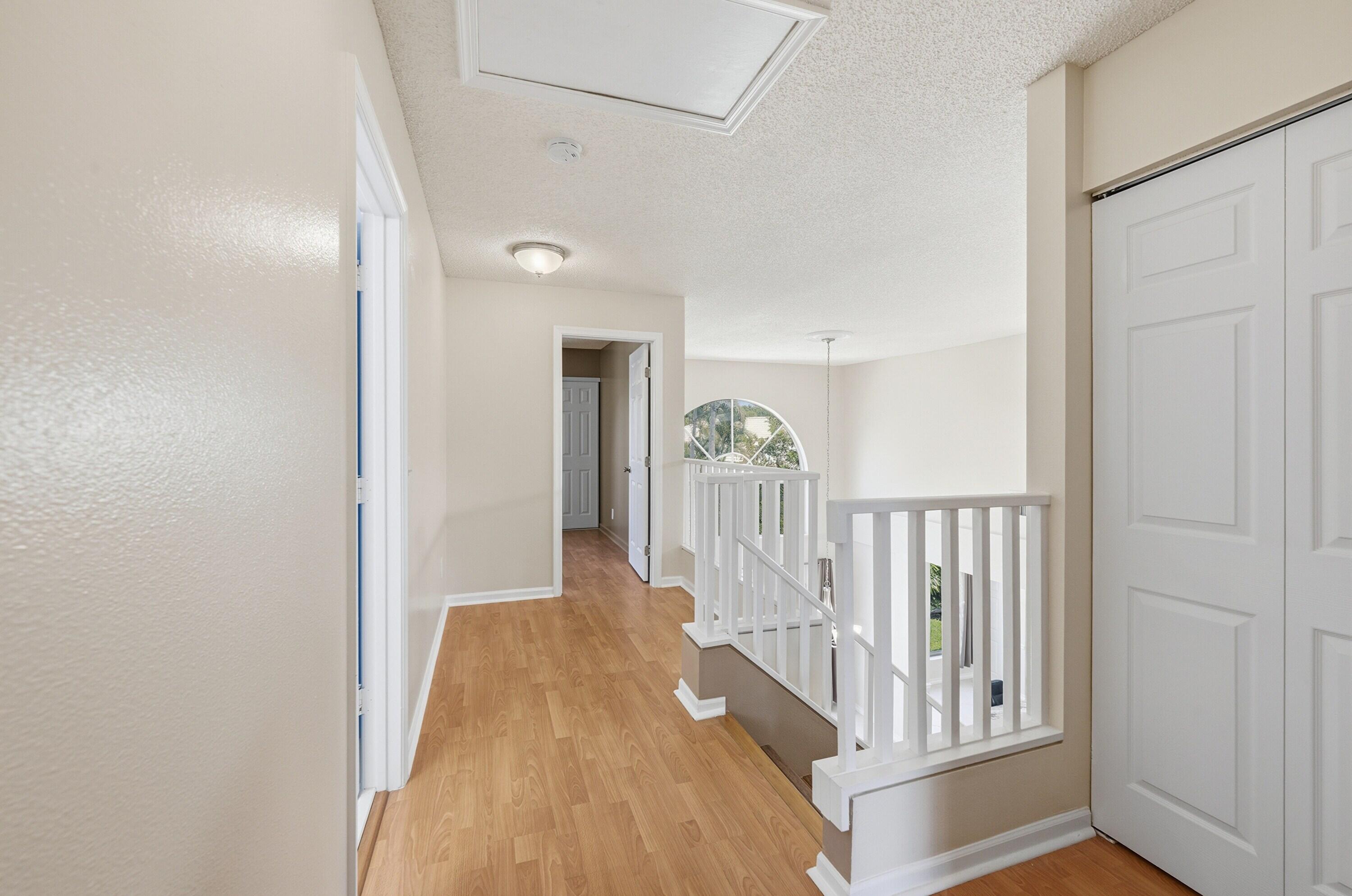 18474 Old Princeton Lane Boca Raton, FL 33498 - Photo 27 of 46 a view of a hallway with a door and stairs