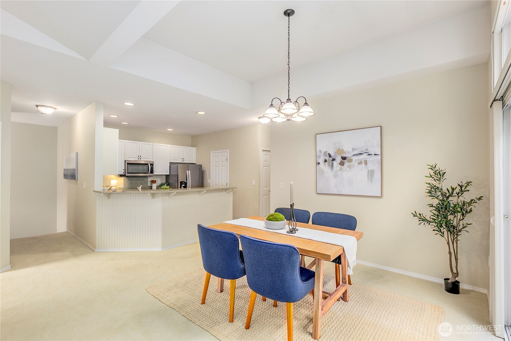 5500 Harbour Pointe Boulevard, Unit B202 Mukilteo, WA 98275 - Photo 11 of 30 a view of a dining room with furniture and a chandelier
