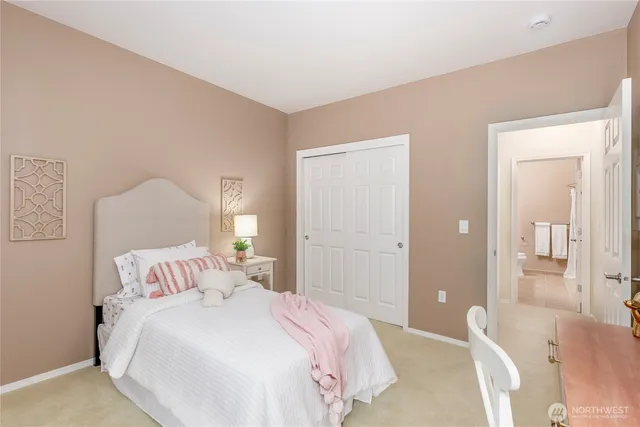 a bedroom with a bed and a couch