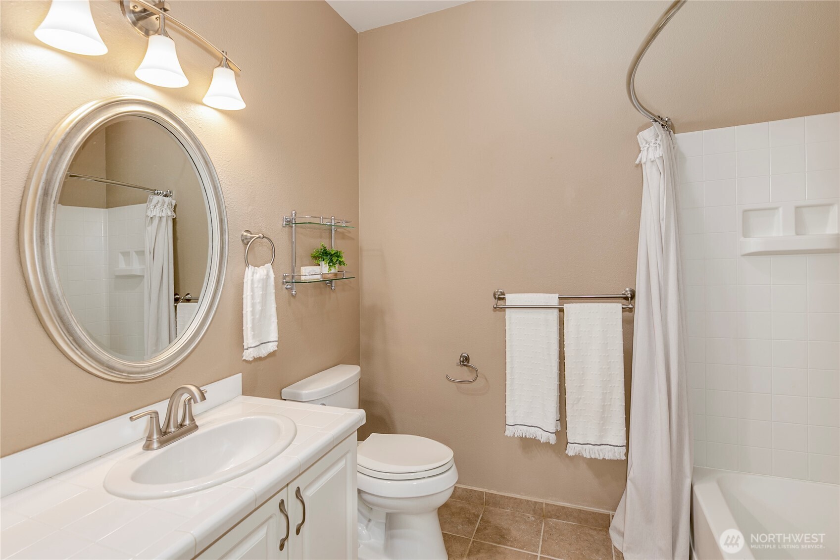 5500 Harbour Pointe Boulevard, Unit B202 Mukilteo, WA 98275 - Photo 22 of 30 a bathroom with a toilet a sink and a mirror