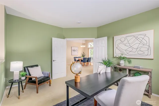 a dining room with furniture and wooden floor