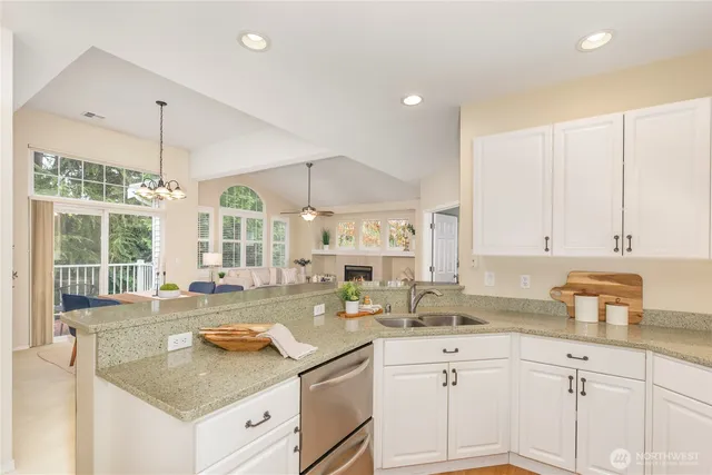 a kitchen with a sink stove and cabinets
