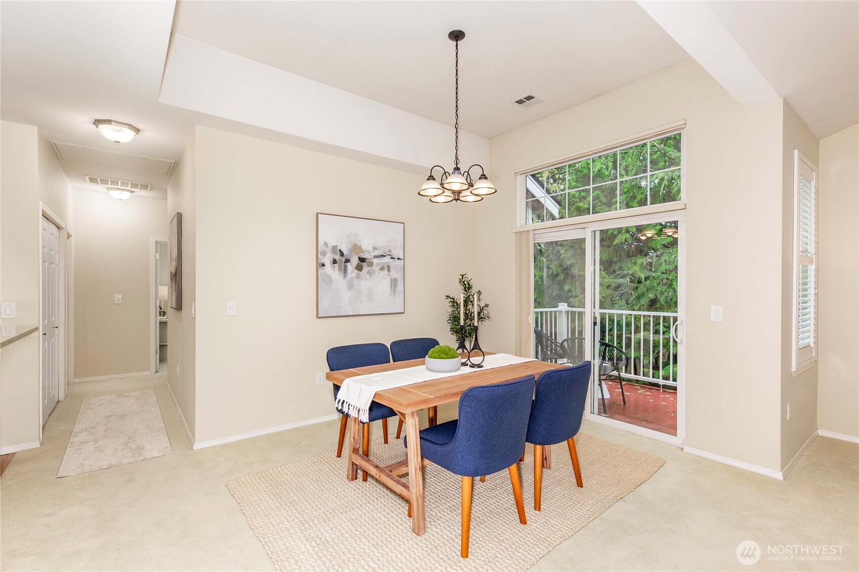 5500 Harbour Pointe Boulevard, Unit B202 Mukilteo, WA 98275 - Photo 10 of 30 a dining room with furniture a chandelier and window
