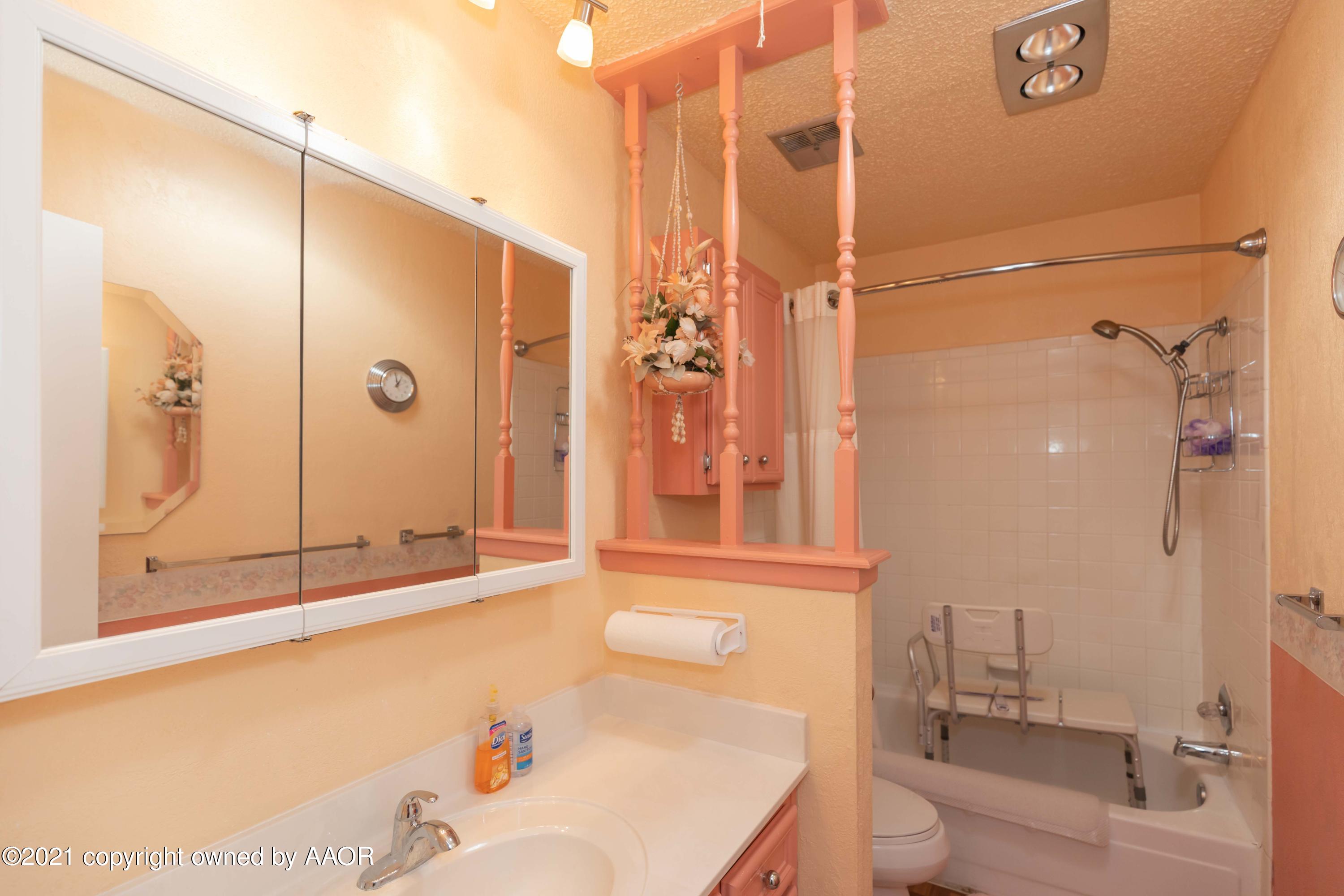 5104 McCarty Boulevard Amarillo, TX 79110 - Photo 22 of 35 a bathroom with a bathtub shower sink and toilet
