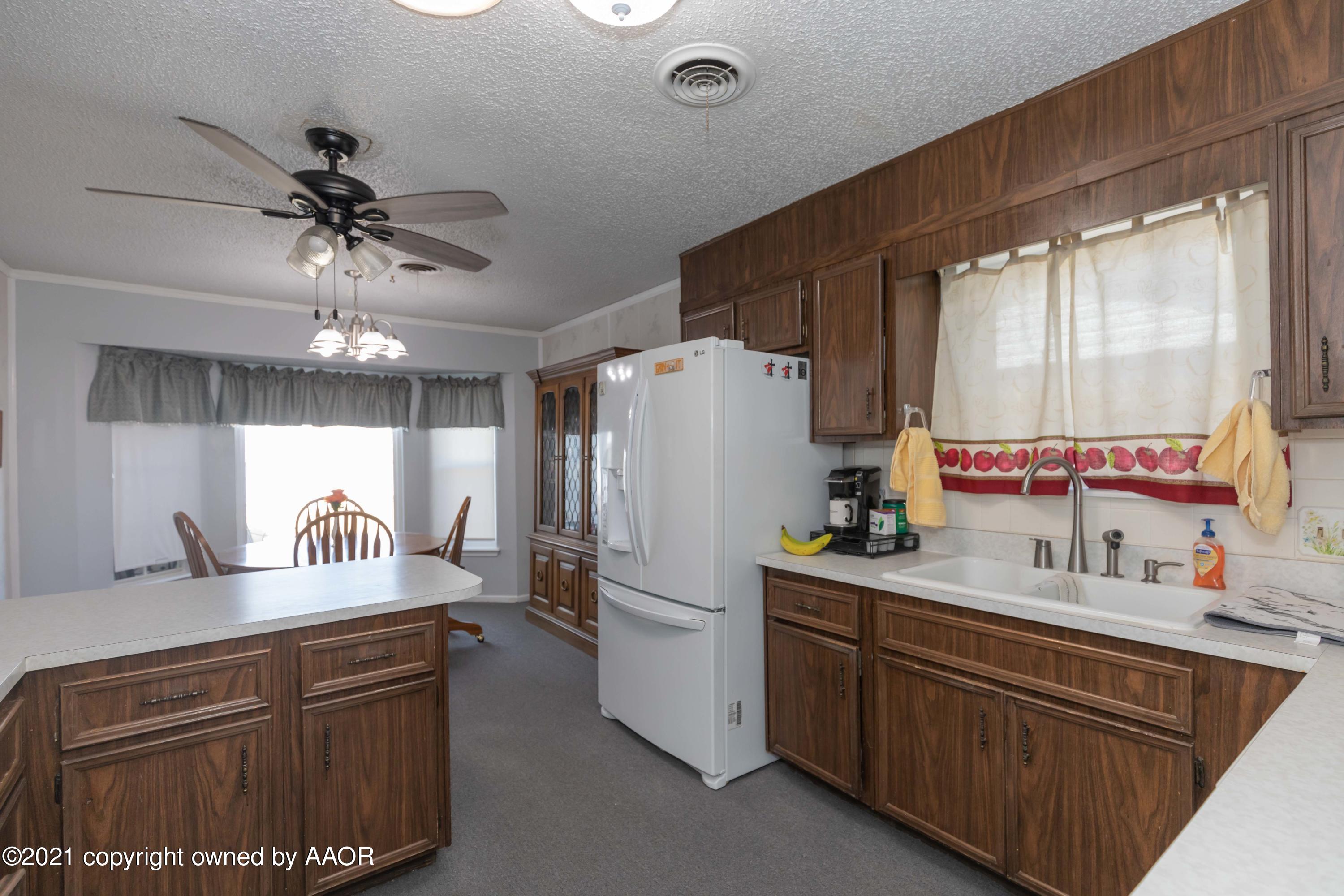 5104 McCarty Boulevard Amarillo, TX 79110 - Photo 10 of 35 a kitchen with a sink appliances and cabinets